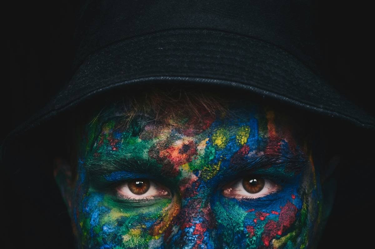 Color theory wheel adapted for editorial makeup showing emotional associations of hues like crimson=power, slate=melancholy