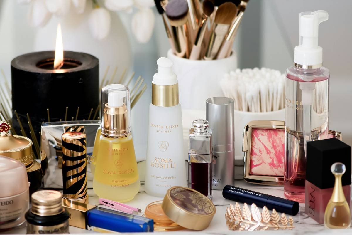 Infographic showing the core pillars of luxury editorial makeup: skin prep, light manipulation, product synergy, and restraint