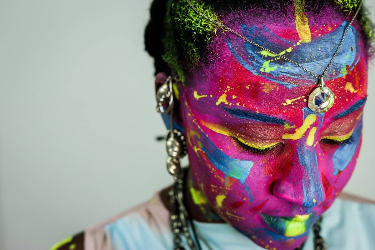 Side-by-side comparison showing subtle daytime makeup vs dramatic editorial bold makeup designs with graphic liner and vivid pigment