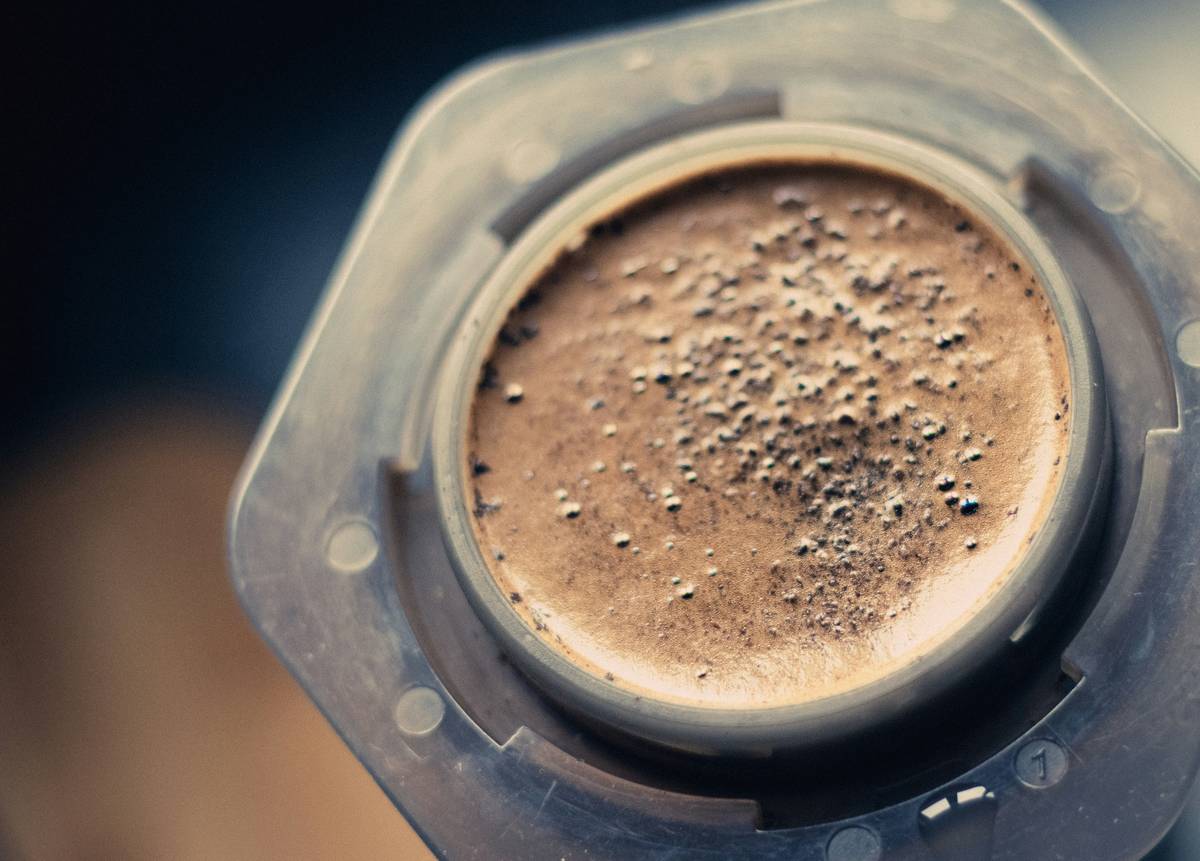 Close-up of natural-looking brows enhanced with eyebrow shading powder applied using a tapered angled brush on lightly prepped skin